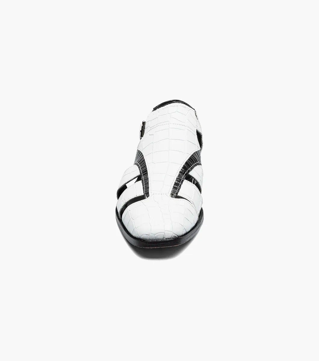 The Stacy Adams Calandro City Sandal (25695-111) features a black and white closed-toe design with cut-out sections, buckle strap, low heel, textured crocodile print leather, and a genuine leather sole.