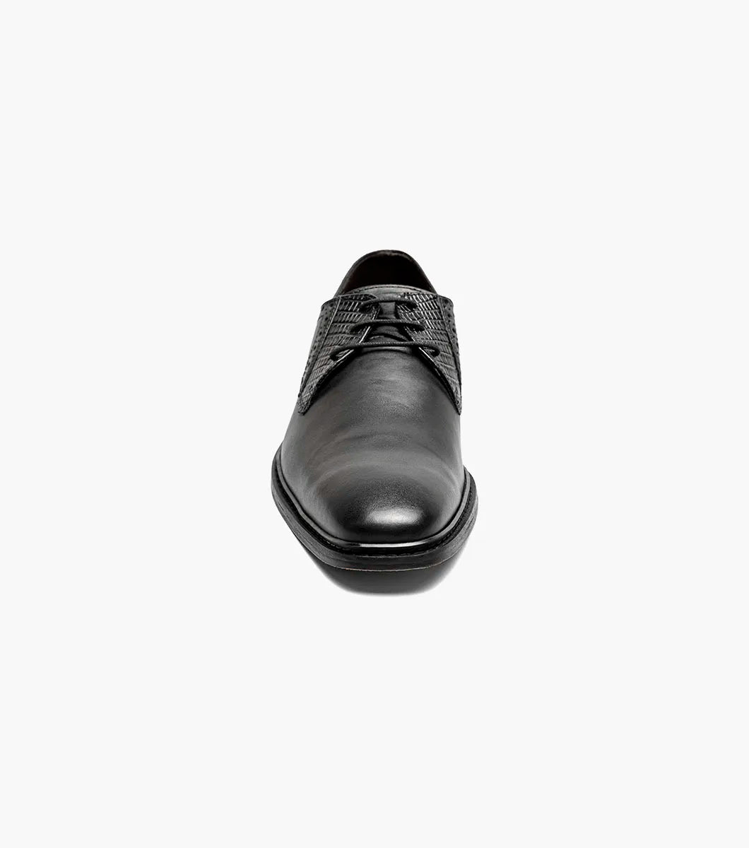 The Stacy Adams Giorgetti Plain Toe Oxford in black features lizard print leather, a low heel, lace-up closure, textured accents by the laces, and a cushioned footbed, shown on a plain white background.