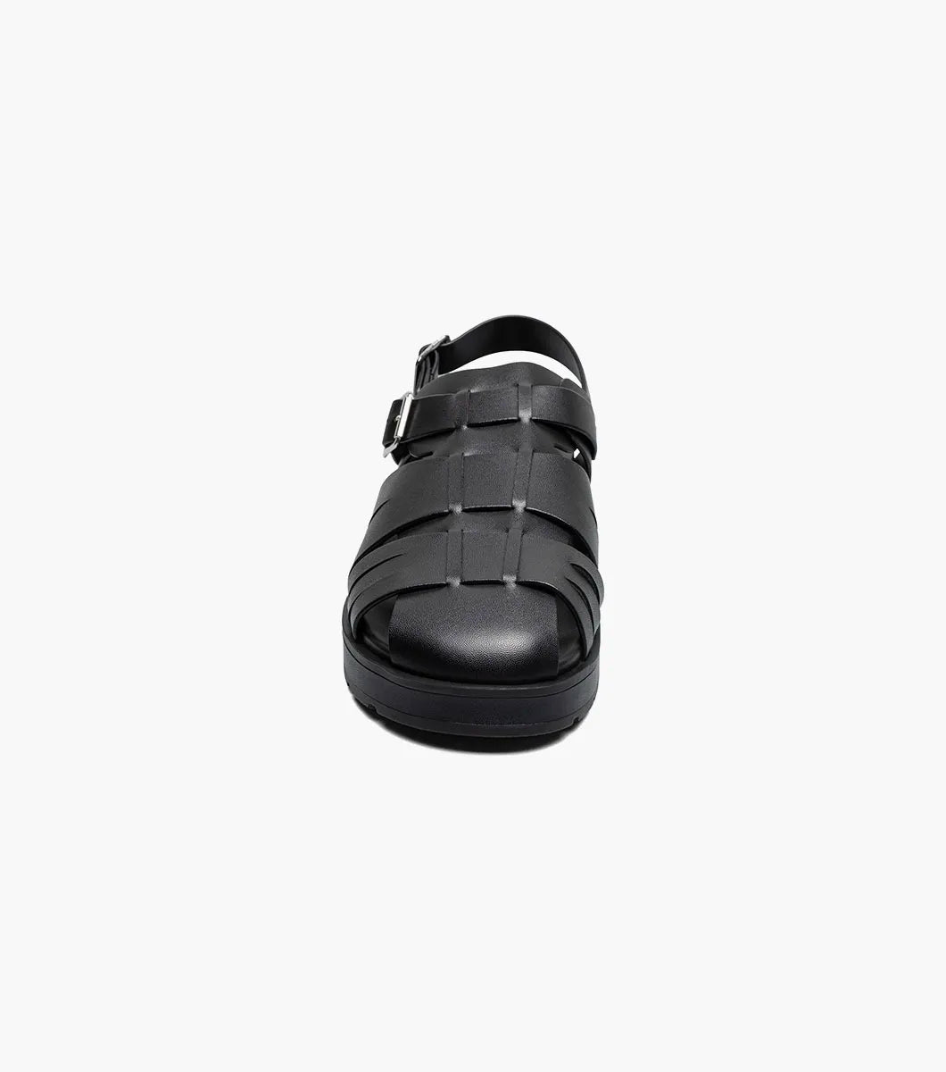 The Stacy Adams Largo Slingback Buckle Sandal (25773-001) features black leather woven straps, an open toe, closed heel, cushioned sole, and adjustable buckles—perfect men’s summer footwear. Shown on a white background.