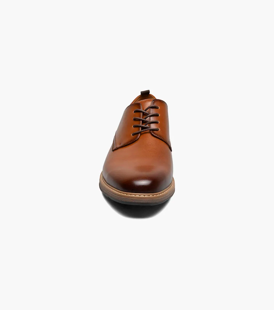 The Stacy Adams Pacer Plain Toe Oxford in Cognac (25754-221) is shown on a white background—its classic lace-up design and low heel make it ideal for both dress casual and formal occasions.
