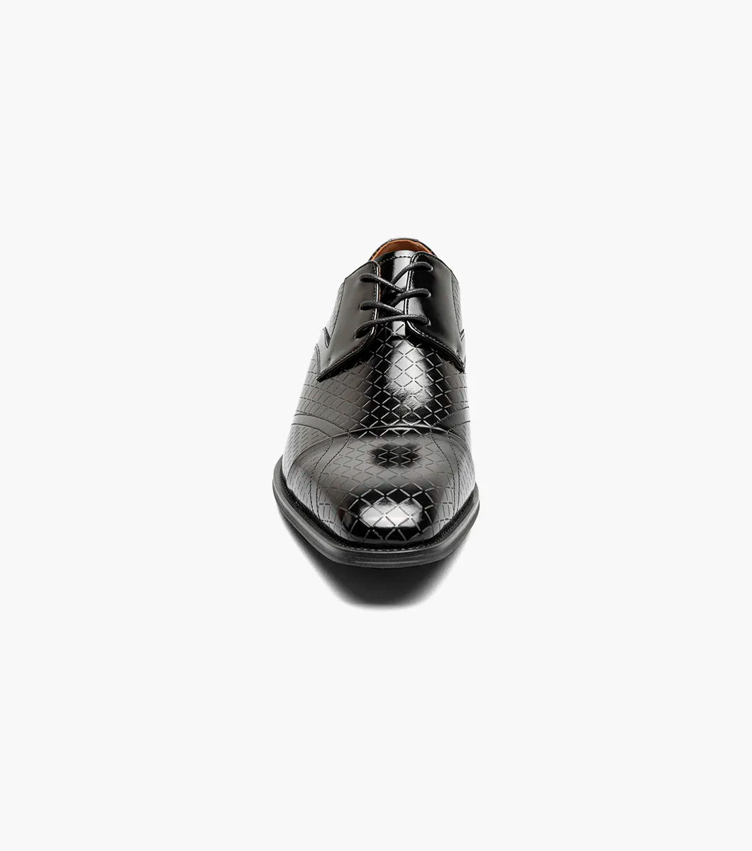The Stacy Adams Hobson Cap Toe Oxford (25764-001) is a single black dress shoe with shiny, laser-etched geometric leather and black laces, displayed on a plain white background.