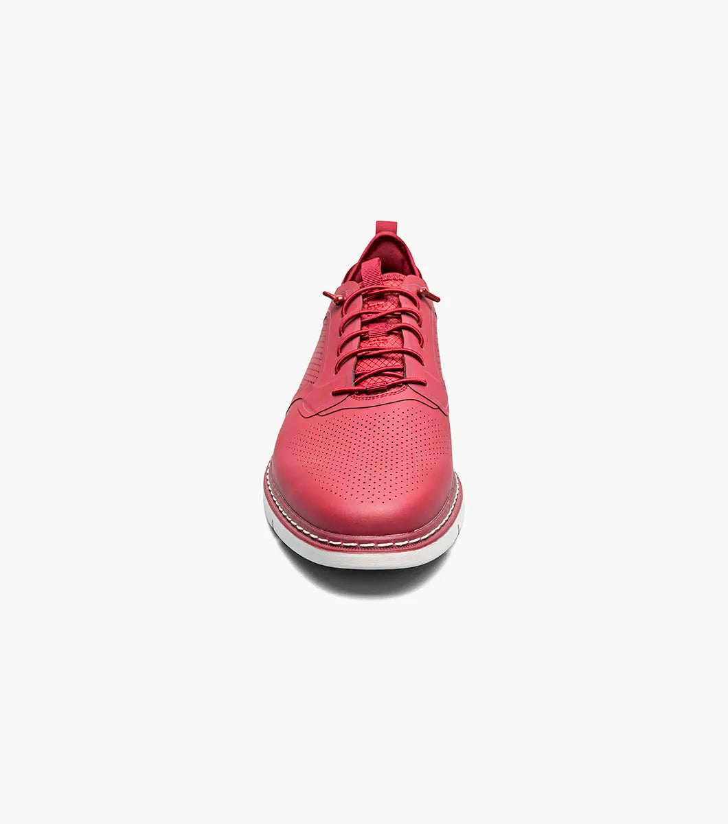 The Stacy Adams Synchro Plain Toe Elastic Lace Up sneaker in Raspberry features perforated detailing, anatomical arch support, and a white sole—shown as a single shoe on a plain white background.