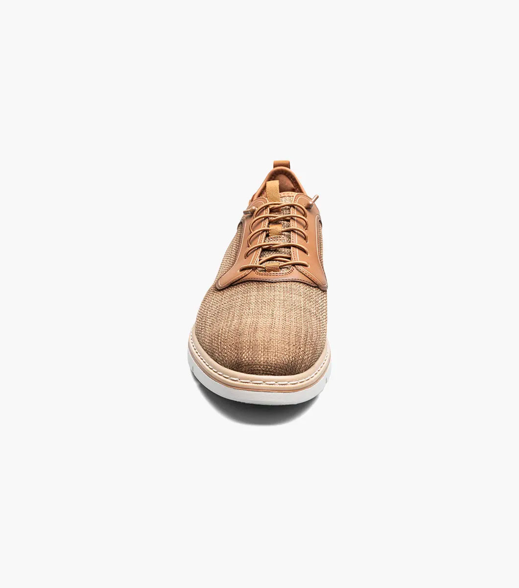 The Stacy Adams Sebert Plain Toe Elastic Lace Up in tan features a textured fabric upper, leather accents, anatomical arch support, and a light rubber sole for comfort, shown on a white background.