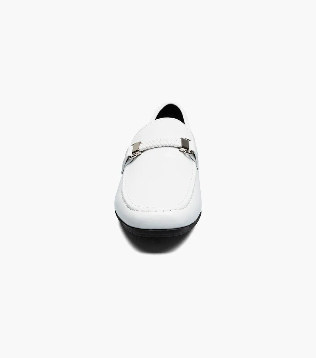 The STACY ADAMS Sheridan Moc Toe Bit Slip On (25761-122) is a white patent loafer with metal bit detail, a black sole, and visible stitching, shown on a plain white background.
