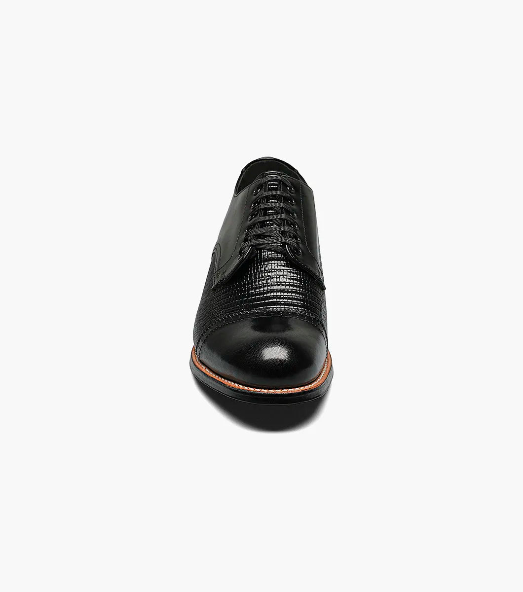 The Stacy Adams Madison Lizard Cap Toe Oxford (00049-01) is a black kidskin leather dress shoe for men, featuring a lizard print cap toe and five eyelets, shown against a white background. Brand: STACY ADAMS.