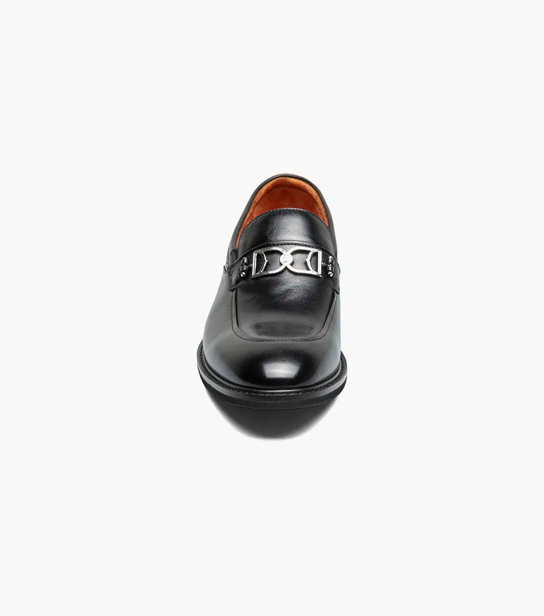 The Stacy Adams Boyd Moc Toe Bit Slip On (Black, 25753-001) features a black leather loafer design with a metal bit detail, low heel, moc toe, visible stitching, and a cushioned footbed for comfort.