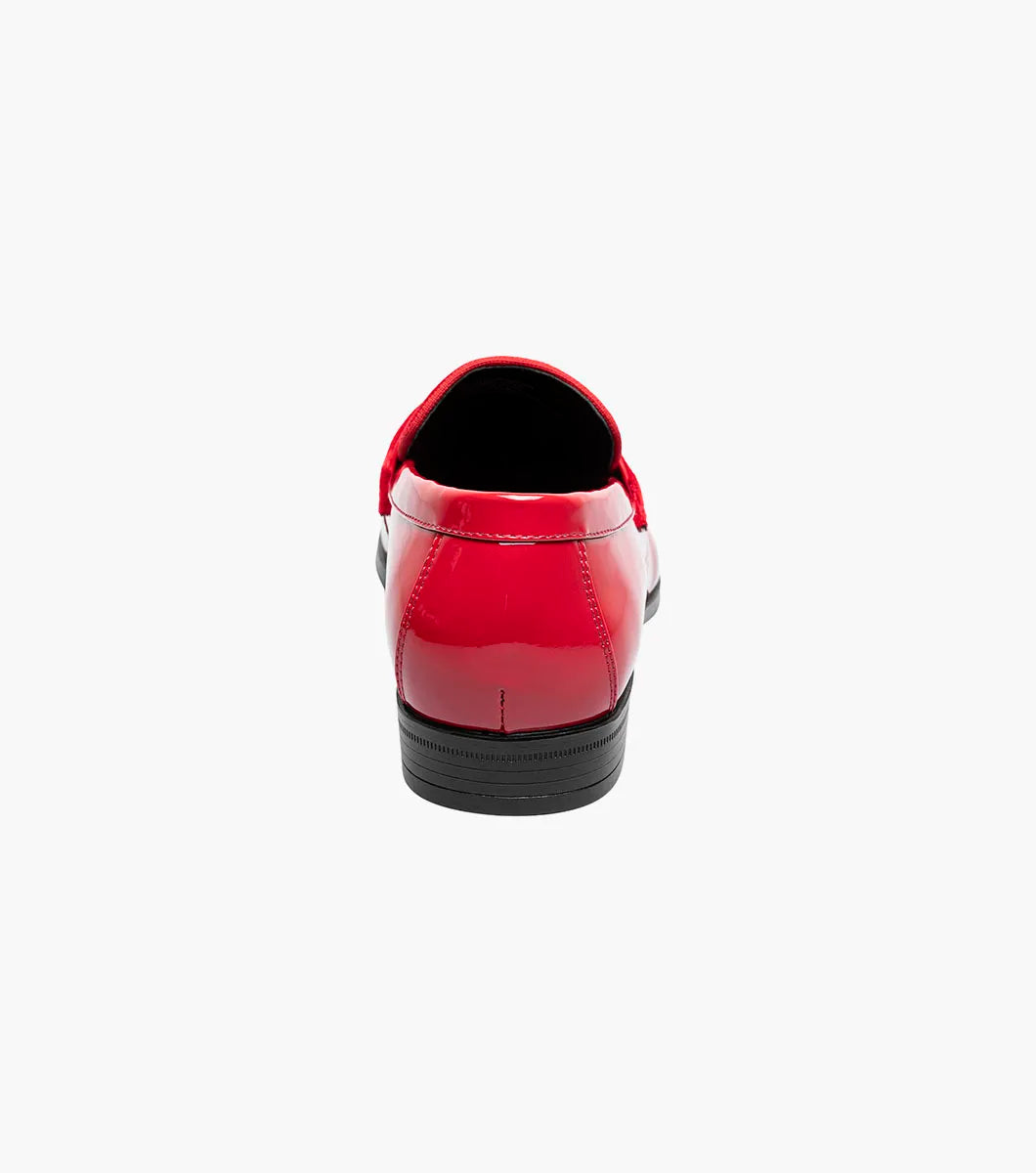 The Stacy Adams Spratley Moc Toe Saddle Slip On in red features a velour upper, matte strap, and black sole. This single shiny loafer (25686-600) by STACY ADAMS is displayed on a white background.