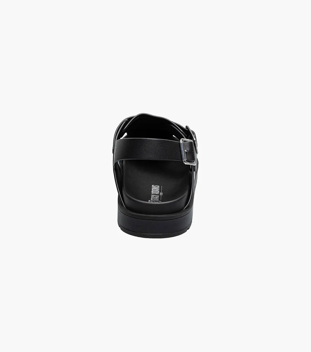 The Stacy Adams Largo Slingback Buckle Sandal (25773-001) features black leather woven straps, an open toe, closed heel, cushioned sole, and adjustable buckles—perfect men’s summer footwear. Shown on a white background.