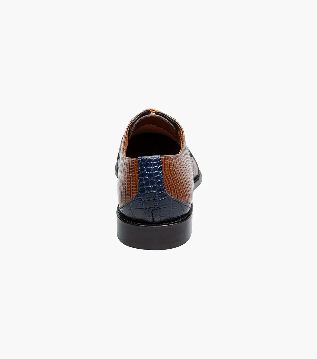 The STACY ADAMS Tristano Modified Bike Toe Oxford (Gray Multi) is a men's dress shoe with anatomical arch support and a sleek black sole, featuring gray multi-tone leather panels.