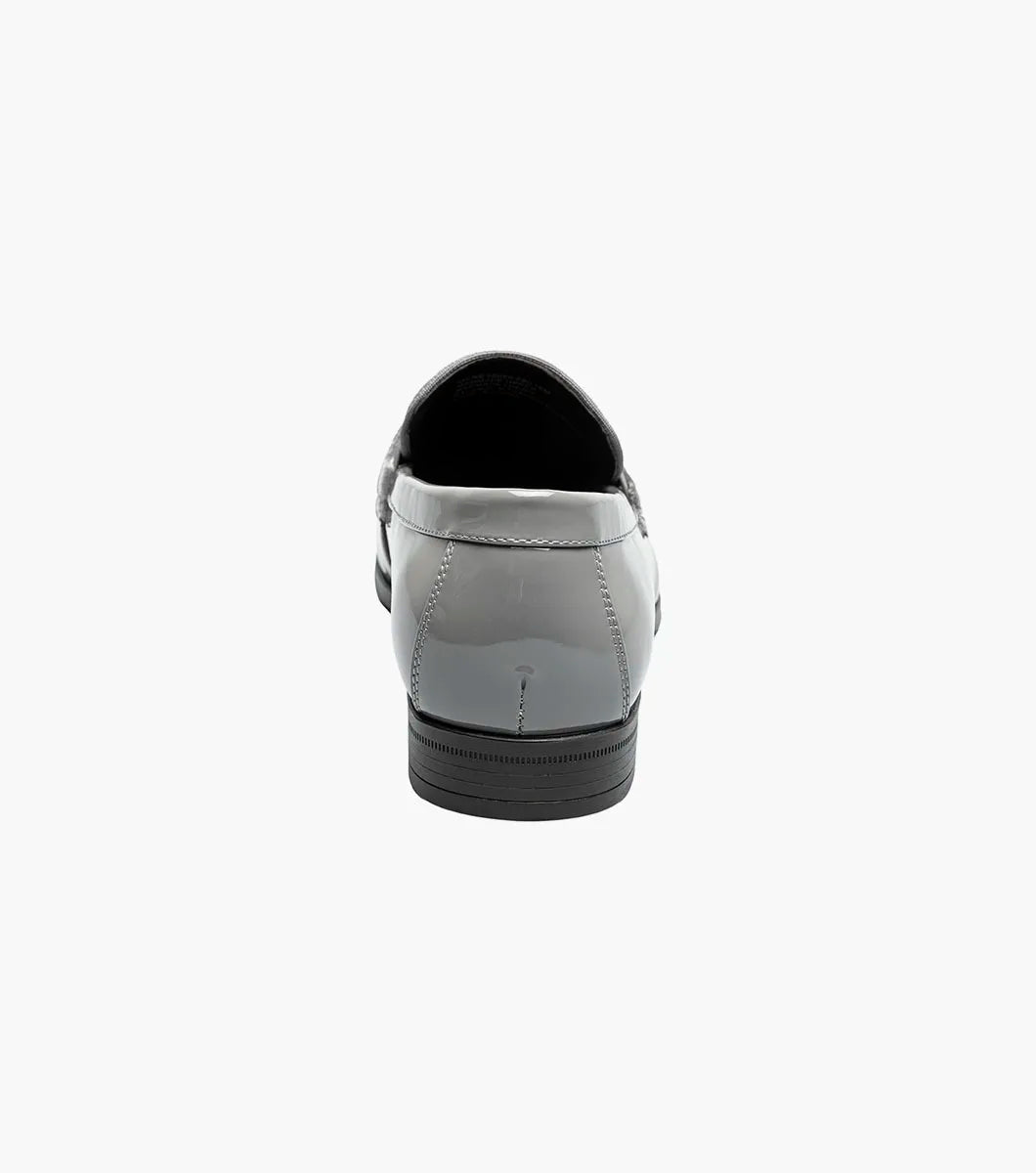 The STACY ADAMS Spratley Moc Toe Saddle Slip On in gray (25686-020) features a velour upper with a shiny patent finish, moc toe slip-on design, low heel, and rounded toe.