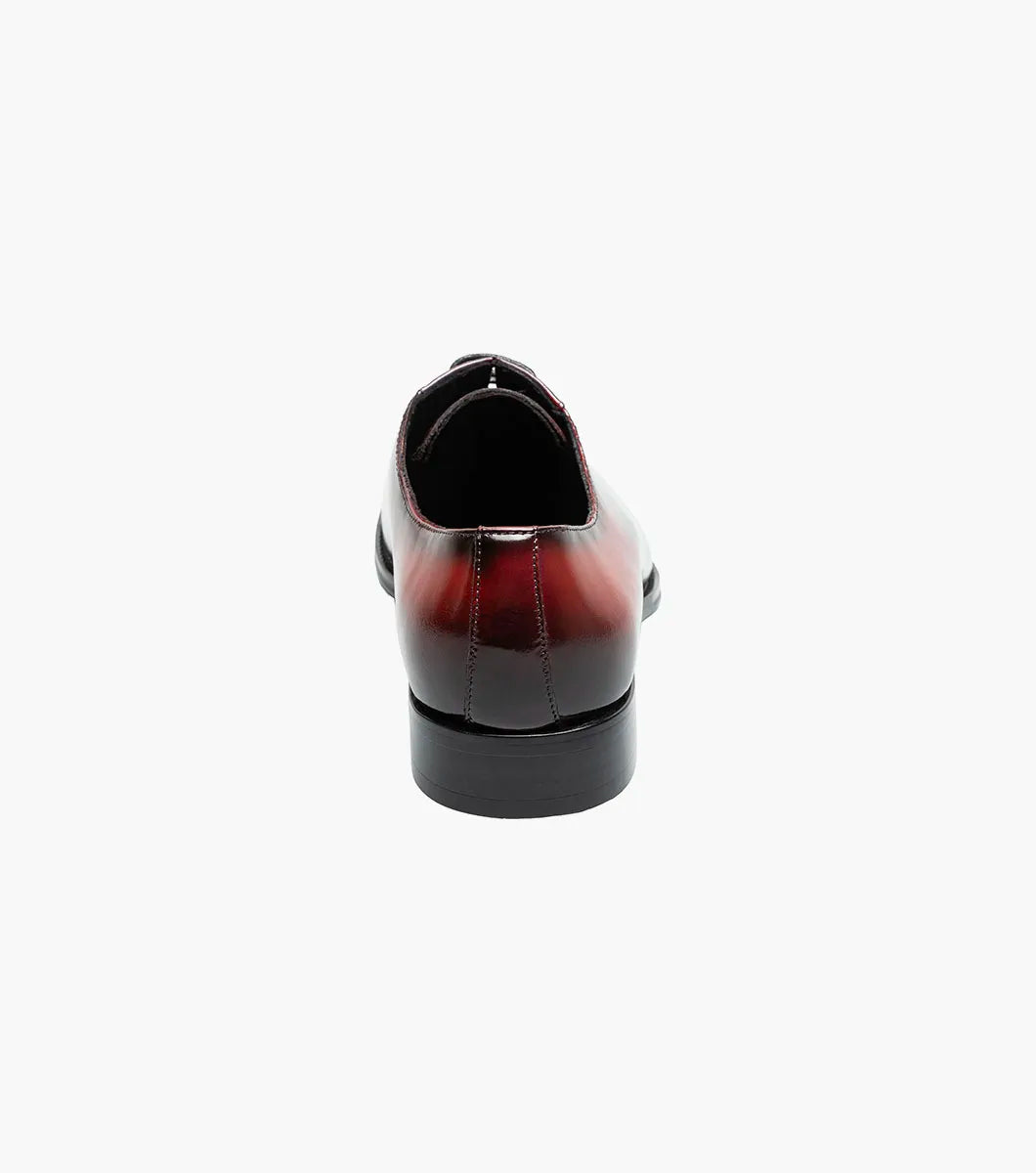 The STACY ADAMS Shaffer Plain Toe Oxford (Navy Multi, 25763-492) features premium calf leather with a gradient from deep red heel to blue toe, dark laces, and a black sole.