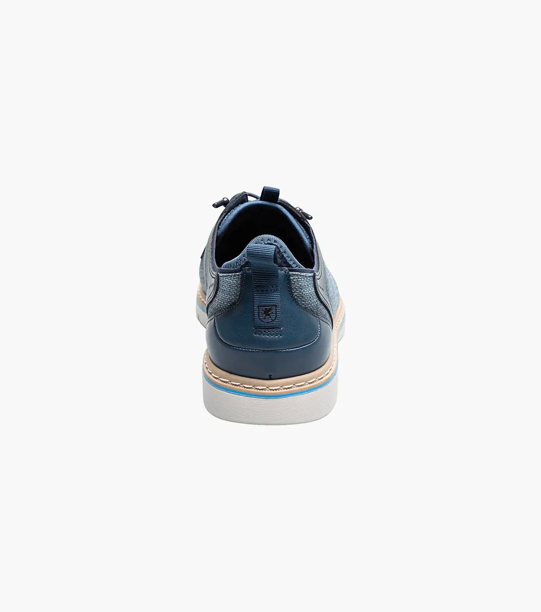 The Stacy Adams Sebert Plain Toe Elastic Lace Up in Navy (25771-410) features a textured upper, smooth leather accents, and a light rubber sole—offering stylish comfort for men. Shown on a plain white background.