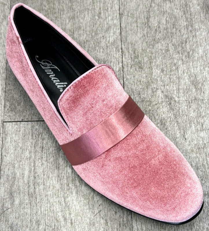 The Exclusive Formal Dress Shoe Pink 7021 by UNIQUE DESIGN MENSWEAR, featuring a pink velvet slip-on design with a shiny pink genuine leather band, sits gracefully on a gray floor, exuding an aura of Italian elegance.