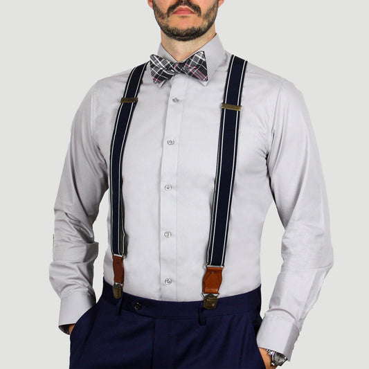 Man wearing an ARTURO Modern Fit Long Sleeve Grey Dress Shirt, plaid bow tie, and navy suspenders with brown leather accents.