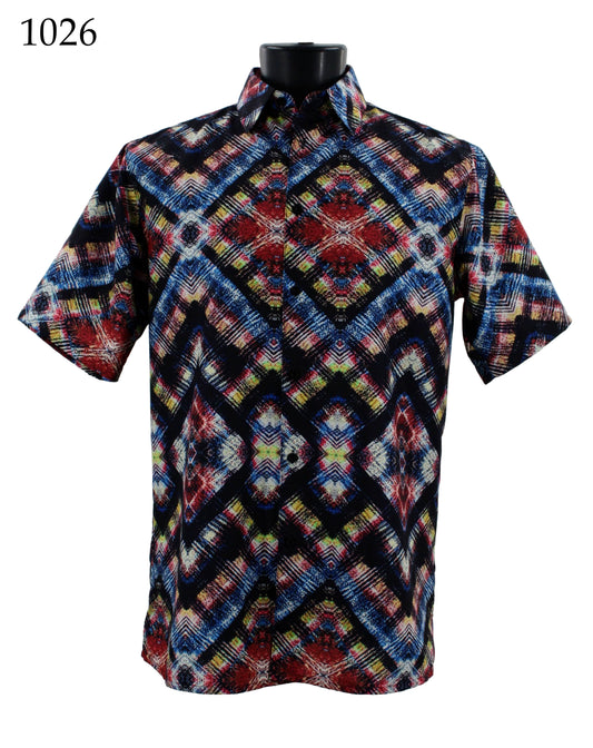 The Bassiri Short Sleeve Shirt 1026 by Bassiri is a regular fit short-sleeve shirt, showcasing a vibrant geometric pattern in red, blue, black, and white, elegantly displayed on a mannequin.