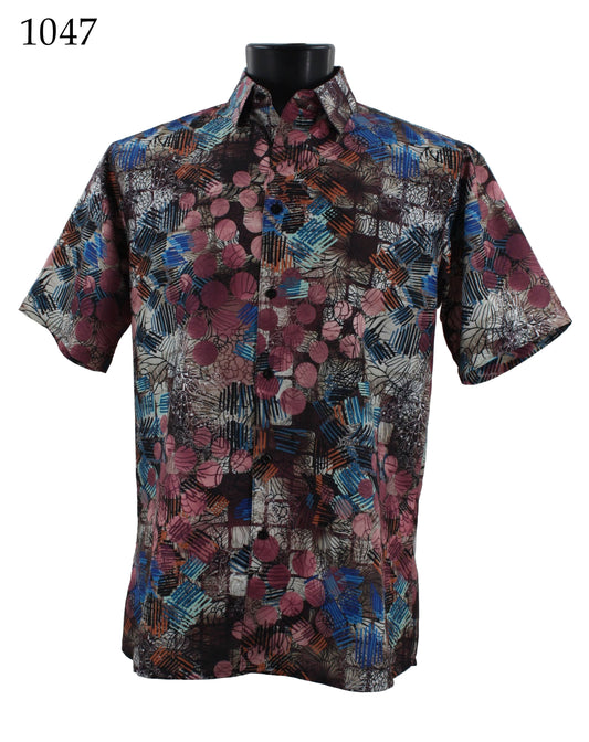 The Bassiri Short Sleeve Shirt 1047 features a geometric abstract pattern in shades of blue, red, and white. This regular fit design is showcased on a black mannequin torso.