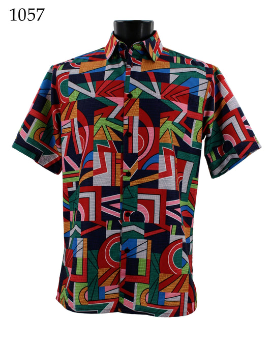 The Bassiri Short Sleeve Shirt 1057, featuring a vibrant geometric pattern in red, blue, green, and white hues and designed with a regular fit, is displayed on a black mannequin torso.