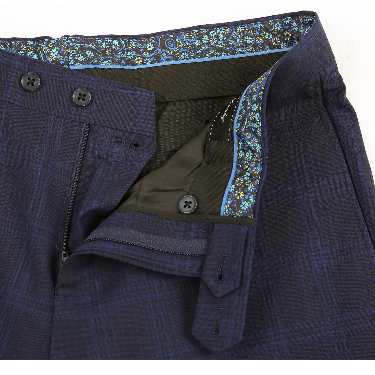 The ENGLISH LAUNDRY Dark Blue Wool Suit EL92-58-555 by English Laundry is a slim fit, plaid wool blazer with two buttons, notch lapels, flap pockets, and a patterned inner lining, shown against a white background.