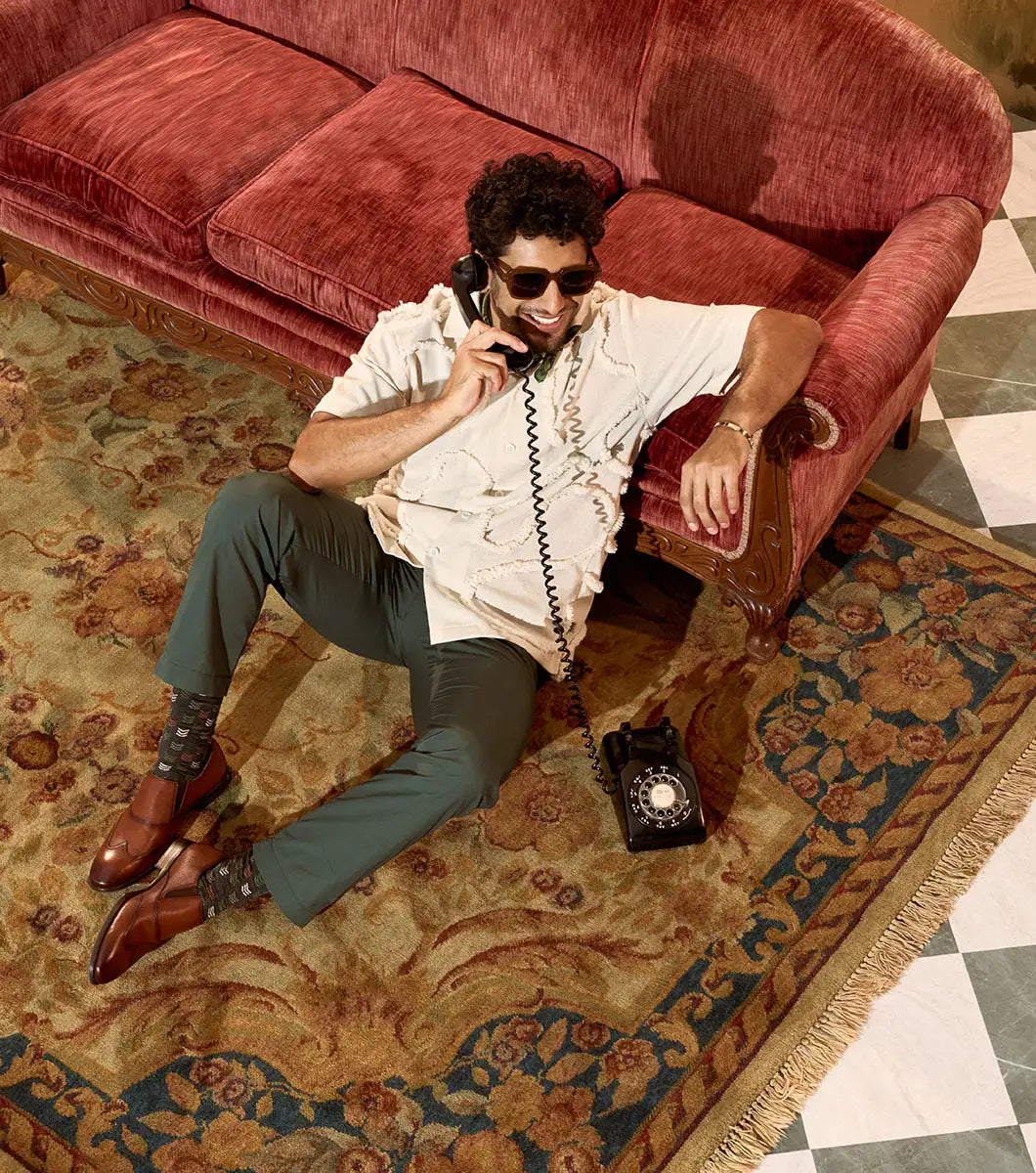 The Stacy Adams Lockwood Wingtip Ornament Slip On in Cognac features classic leather style with a textured upper, single side buckle, and low stacked heel—perfect for men seeking timeless dress shoes.