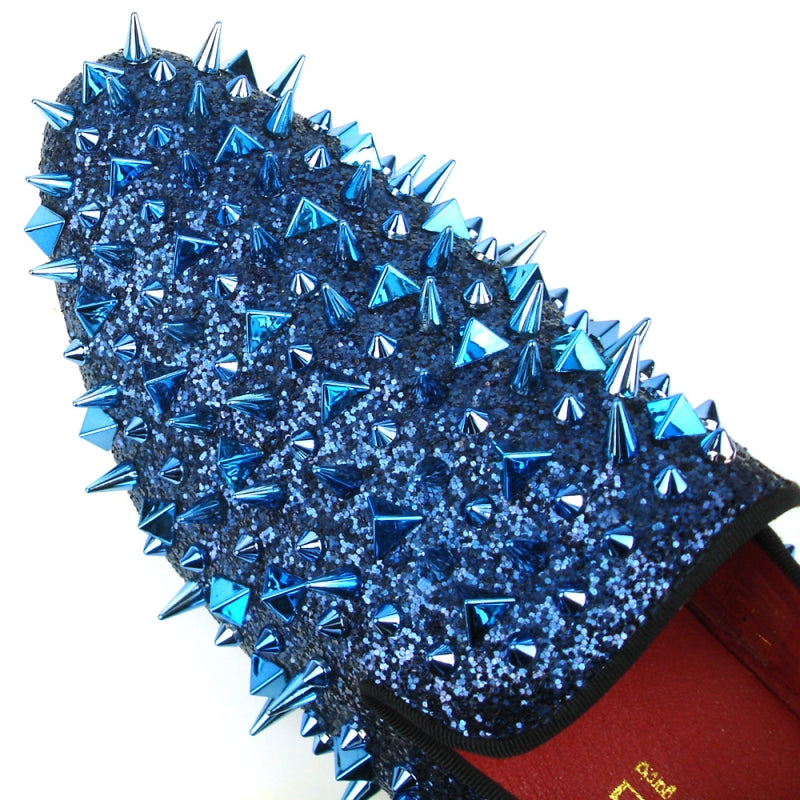 The FI-7239 Navy Glitter Navy Spikes slip-on by Fiesso features dazzling navy glitter and spikes, a bold red interior, and a black sole for a statement-making look.