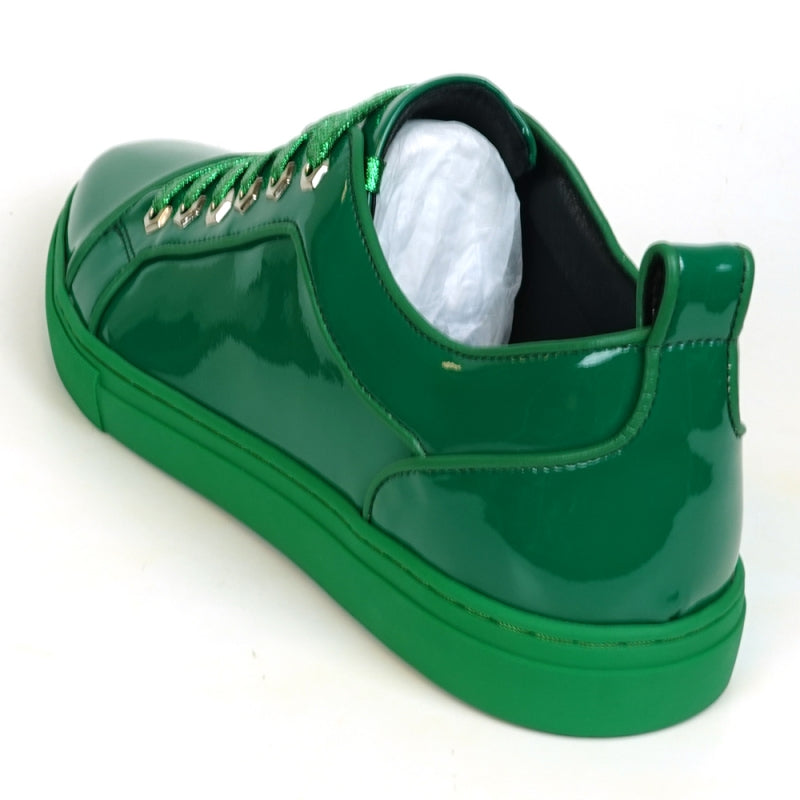 The Fiesso FI-2415-2 is a shiny green patent leather low-cut sneaker with matching green laces and a green rubber sole, ideal for enhancing any casual outfit.