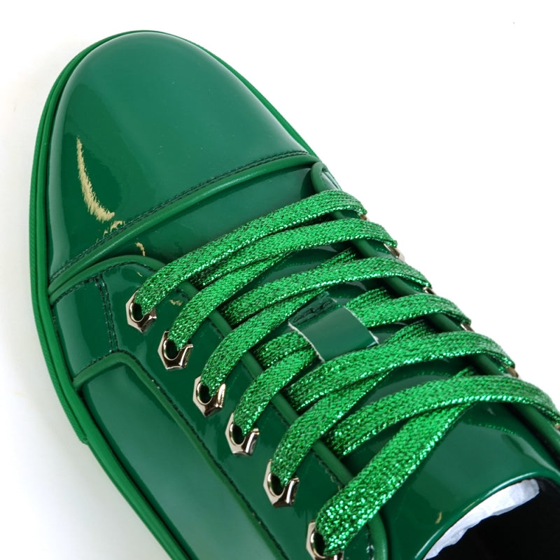 The Fiesso FI-2415-2 is a shiny green patent leather low-cut sneaker with matching green laces and a green rubber sole, ideal for enhancing any casual outfit.