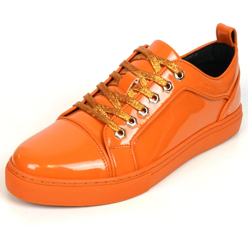 The Fiesso FI-2415-2 Orange Patent Lace-up Low-Cut Leather Sneaker boasts shiny orange patent leather and matching laces, designed for men's casual wear. Set against a crisp white backdrop, these sneakers stylishly blend comfort and trendiness.