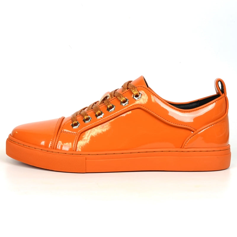 The Fiesso FI-2415-2 Orange Patent Lace-up Low-Cut Leather Sneaker boasts shiny orange patent leather and matching laces, designed for men's casual wear. Set against a crisp white backdrop, these sneakers stylishly blend comfort and trendiness.