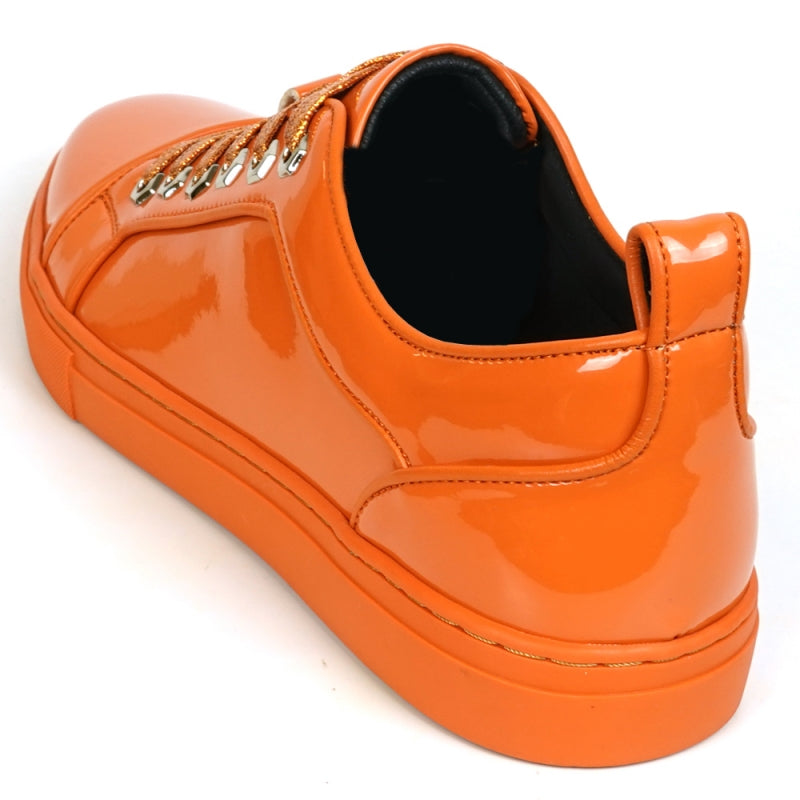 The Fiesso FI-2415-2 Orange Patent Lace-up Low-Cut Leather Sneaker boasts shiny orange patent leather and matching laces, designed for men's casual wear. Set against a crisp white backdrop, these sneakers stylishly blend comfort and trendiness.