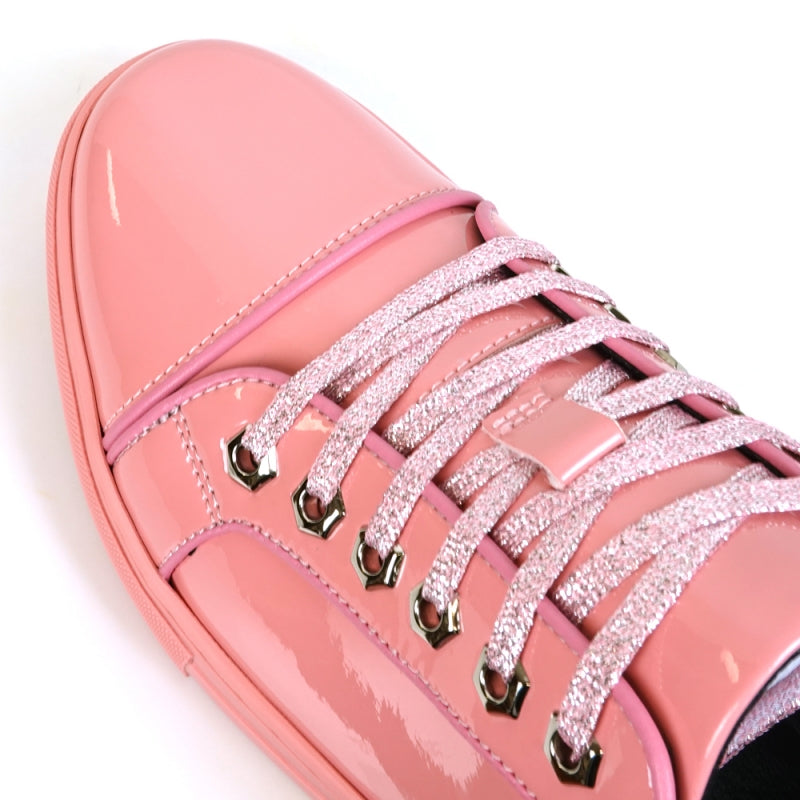 Close-up of the Fiesso FI-2415-2 sneaker in shiny pink patent leather, featuring sparkly pink laces, metallic eyelets, and a cushioned insole for ultimate comfort.