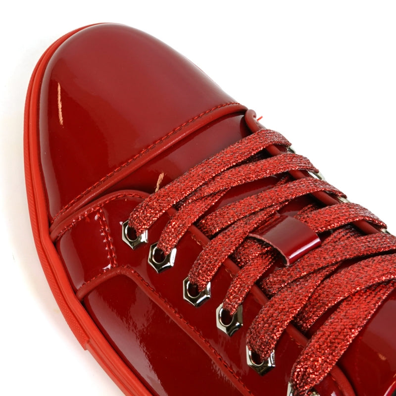 Fiesso's FI-2415-2 Red Patent Lace-up Low Cut Leather Sneaker is striking with its red patent finish, vibrant laces, bold rubber sole, and a glitter upper that adds a glamorous touch—perfect for those seeking style and flair.