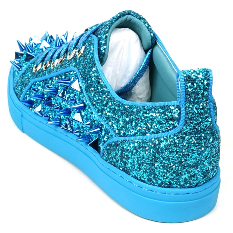 Introducing the FI-2429 Blue Glitter Blue Spikes Low Cut Sneaker Encore by Fiesso, featuring a stunning blue glitter exterior with metallic spikes, complemented by blue laces and a sleek blue sole. This bold design uniquely twists traditional men's dress shoes.
