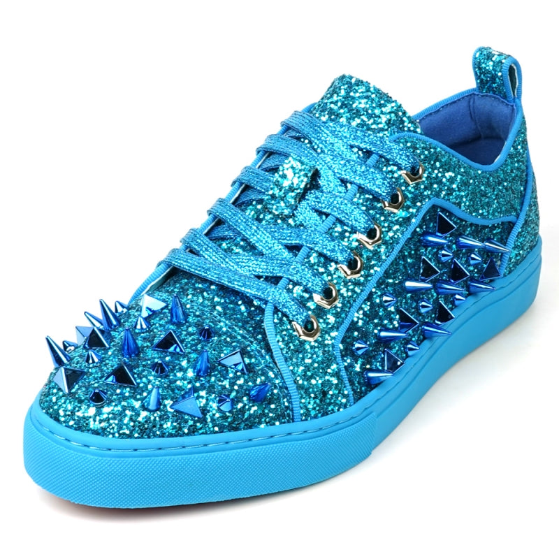 Introducing the FI-2429 Blue Glitter Blue Spikes Low Cut Sneaker Encore by Fiesso, featuring a stunning blue glitter exterior with metallic spikes, complemented by blue laces and a sleek blue sole. This bold design uniquely twists traditional men's dress shoes.
