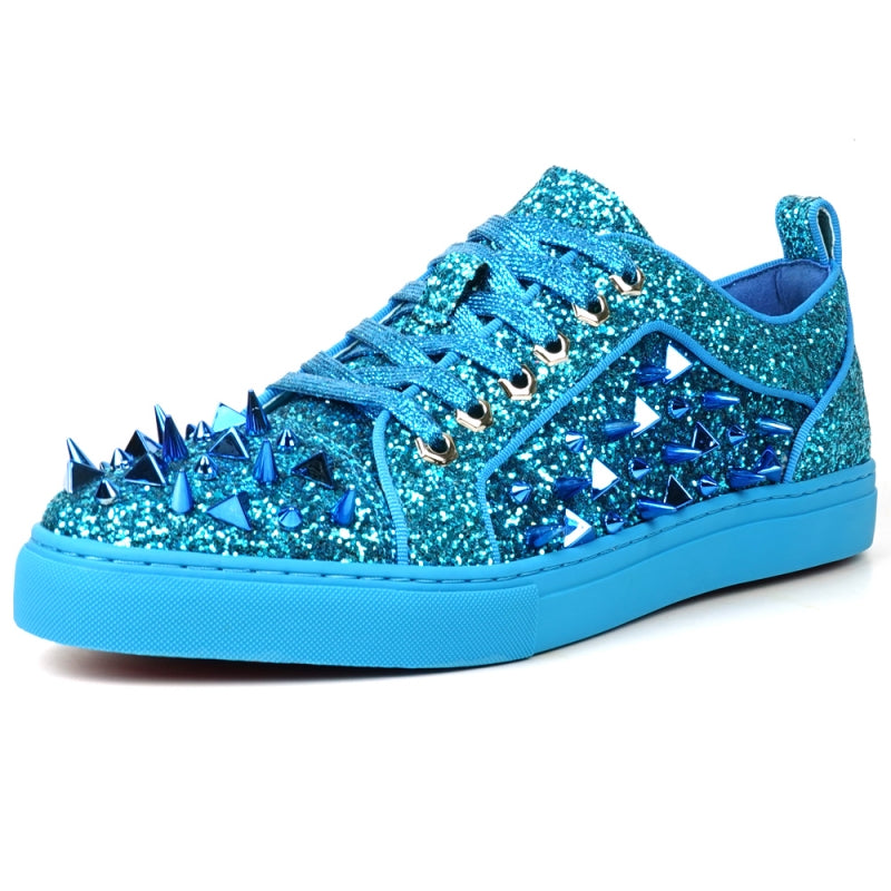 Introducing the FI-2429 Blue Glitter Blue Spikes Low Cut Sneaker Encore by Fiesso, featuring a stunning blue glitter exterior with metallic spikes, complemented by blue laces and a sleek blue sole. This bold design uniquely twists traditional men's dress shoes.