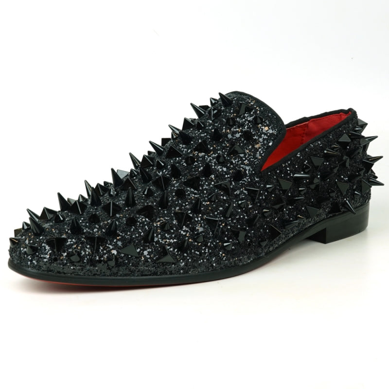 The FI-7517 Black Glitter Black Spikes Slip On Loafer by Fiesso is a striking masterpiece, adorned with black spikes and glitter, featuring a luxurious red interior lining. This exquisite shoe boasts a leather upper that promises both elegance and durability.