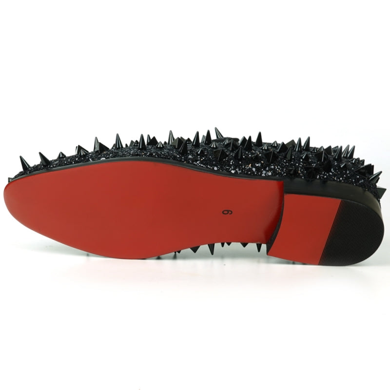 The FI-7517 Black Glitter Black Spikes Slip On Loafer by Fiesso is a striking masterpiece, adorned with black spikes and glitter, featuring a luxurious red interior lining. This exquisite shoe boasts a leather upper that promises both elegance and durability.