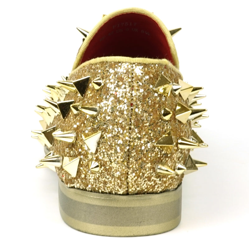 The FI-7517 Gold Glitter Slip on Loafer by Fiesso features a pony hair upper with sharp conical gold spikes and a red inner lining.