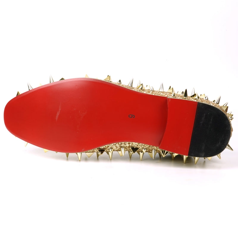 The FI-7517 Gold Glitter Slip on Loafer by Fiesso features a pony hair upper with sharp conical gold spikes and a red inner lining.