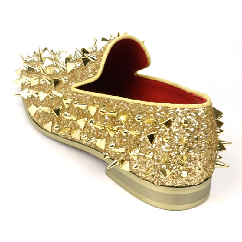 The FI-7517 Gold Glitter Slip on Loafer by Fiesso features a pony hair upper with sharp conical gold spikes and a red inner lining.