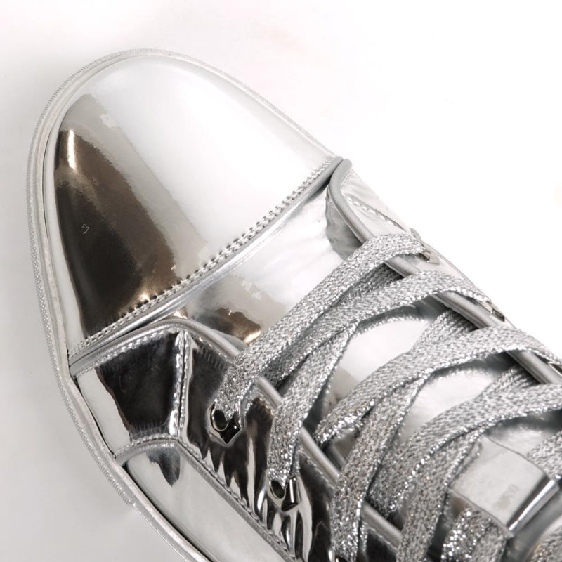 The Fiesso FI-2416-2 Silver Patent Leather High Top Sneaker features a shiny metallic silver finish, silver laces, and a white rubber sole, shown solo against a plain white background.