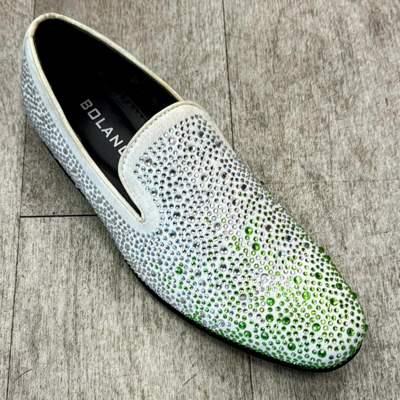 A single Exclusive Formal Dress Shoe Green / White FROST by UNIQUE DESIGN MENSWEAR, crafted from genuine leather and adorned with shimmering rhinestones, rests elegantly on a wooden floor.