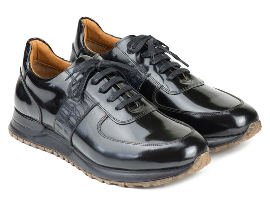 The Paul Parkman Men's Black Polished Leather Sneakers - LP208BLK, by Paul Parkman, showcase shiny black leather with brown rubber soles, complete with laces and a patterned side panel, embodying the essence of luxury fashion sneakers.