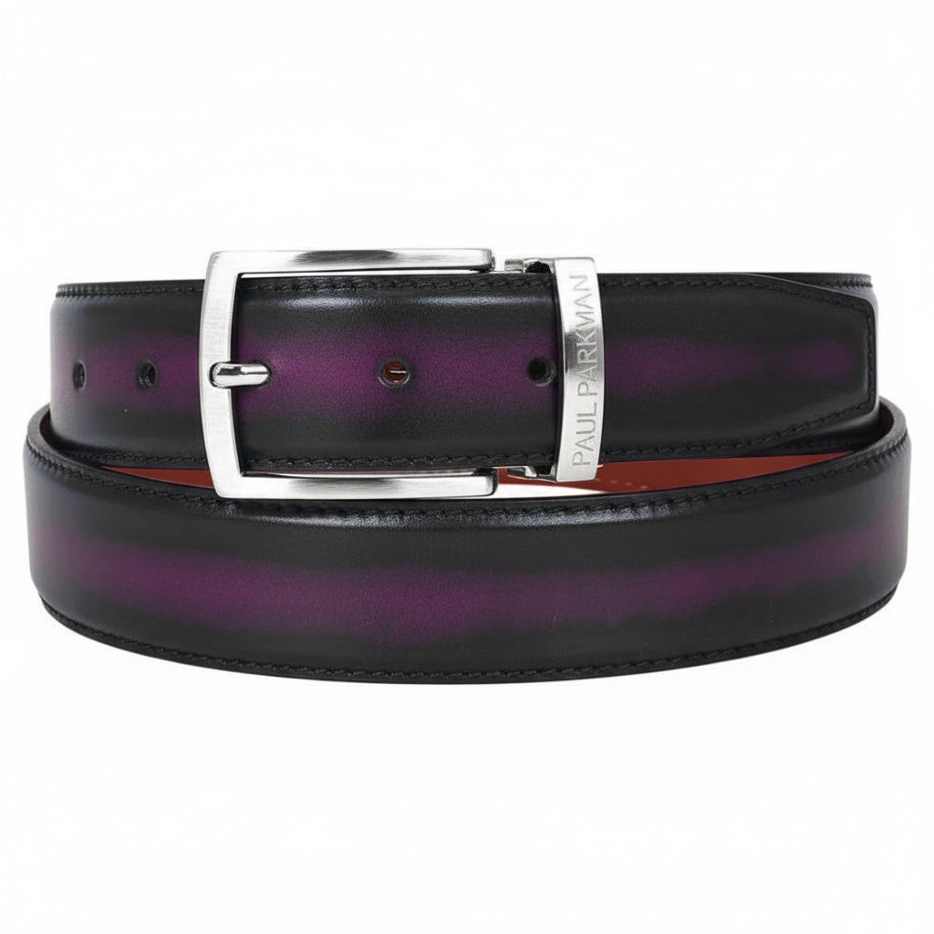 The Paul Parkman Men's Dual Color Patina Hand-Painted Leather Belt (Purple & Black B01-B) features black and purple hand-painted leather with a silver rectangular "PAUL PARKMAN" engraved buckle, shown coiled on a white background.
