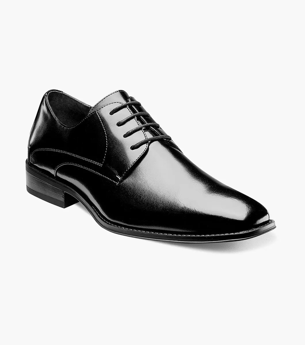 The STACY ADAMS Wayde Plain Toe Oxford (Black, 20144-001) is a leather lace-up dress shoe with a low heel, cushioned footbed, and polished finish, shown here on a plain white background.
