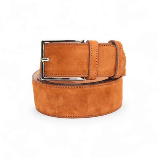 The Emilio Franco Cognac Suede Belt 202 is a luxury men's belt, expertly handcrafted in Italy from premium suede and finished with a silver buckle.