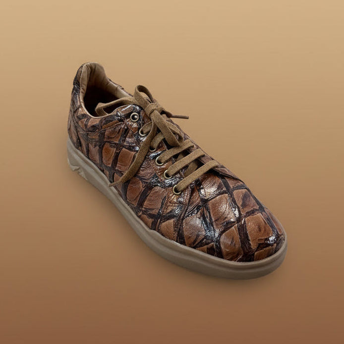 The BELVEDERE Belvedere Shoe 9 in size 8.5 features a shiny, textured, reptile-patterned brown surface and is shown displayed on a wooden surface in-store. Please note: this item is final sale.