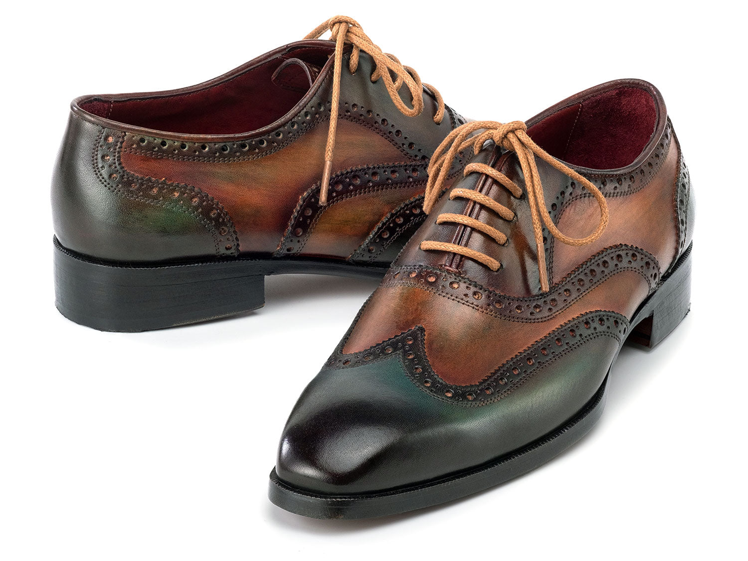 The Paul Parkman Wingtip Oxfords Green Handpainted Calfskin - 228-GRN feature brown and green hand-painted leather with brogue detailing and tan laces, shown on a white background.