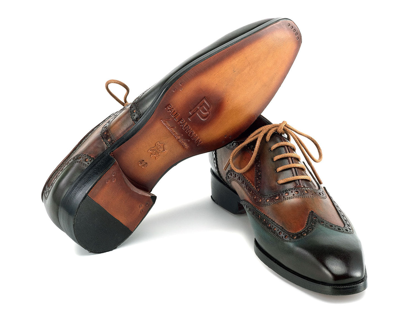 The Paul Parkman Wingtip Oxfords Green Handpainted Calfskin - 228-GRN feature brown and green hand-painted leather with brogue detailing and tan laces, shown on a white background.