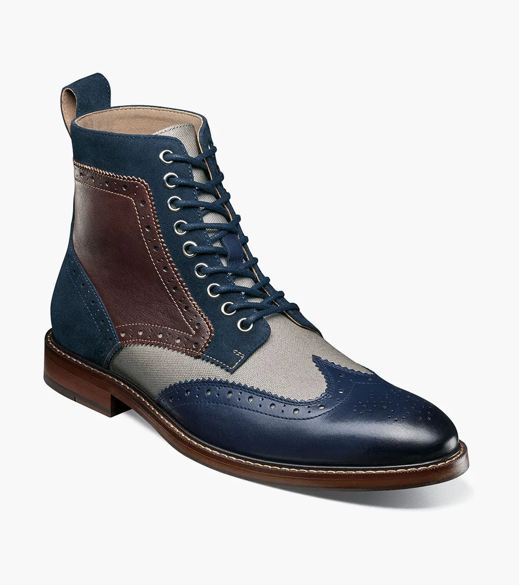 The STACY ADAMS Finnegan Wingtip Lace Up Boot (Navy Multi) features navy, brown, and gray leather with perforated details, suede accents, memory foam insole for comfort, and a classic brown sole.