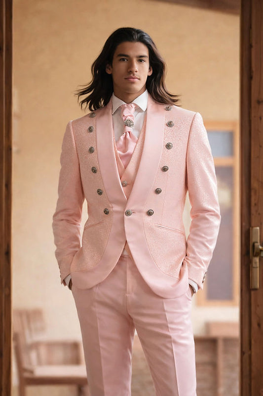 A man with long hair stands indoors wearing the Manzini Midland 3-Piece Slim-Fit Vintage Tuxedo Prom Wedding Suit with satin trim in peach by Manzini.
